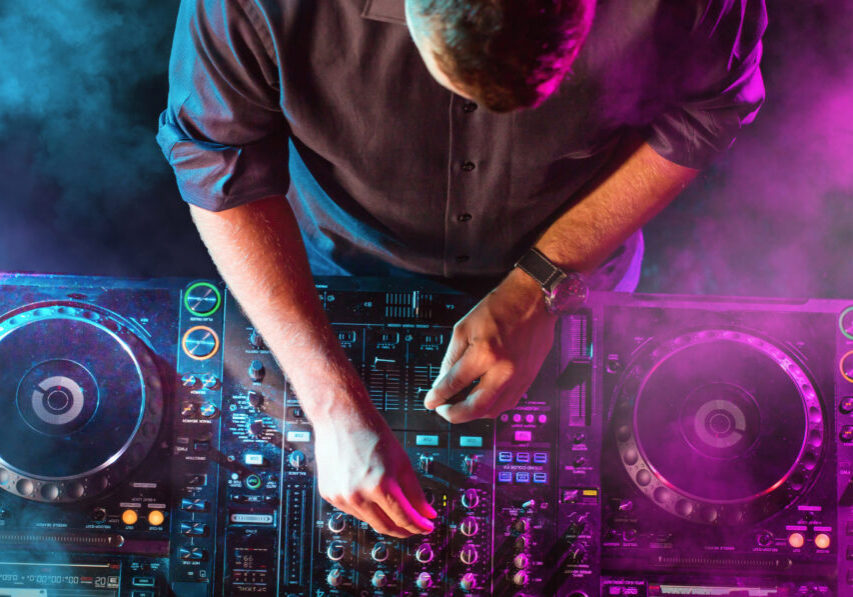 Charismatic disc jockey at the turntable. DJ plays on the best,